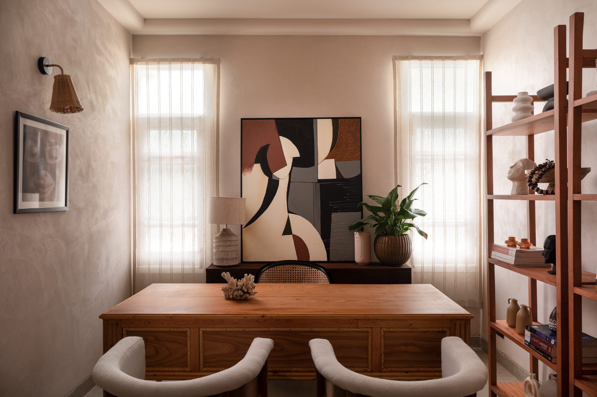 Consultation room with sculptural art between two windows