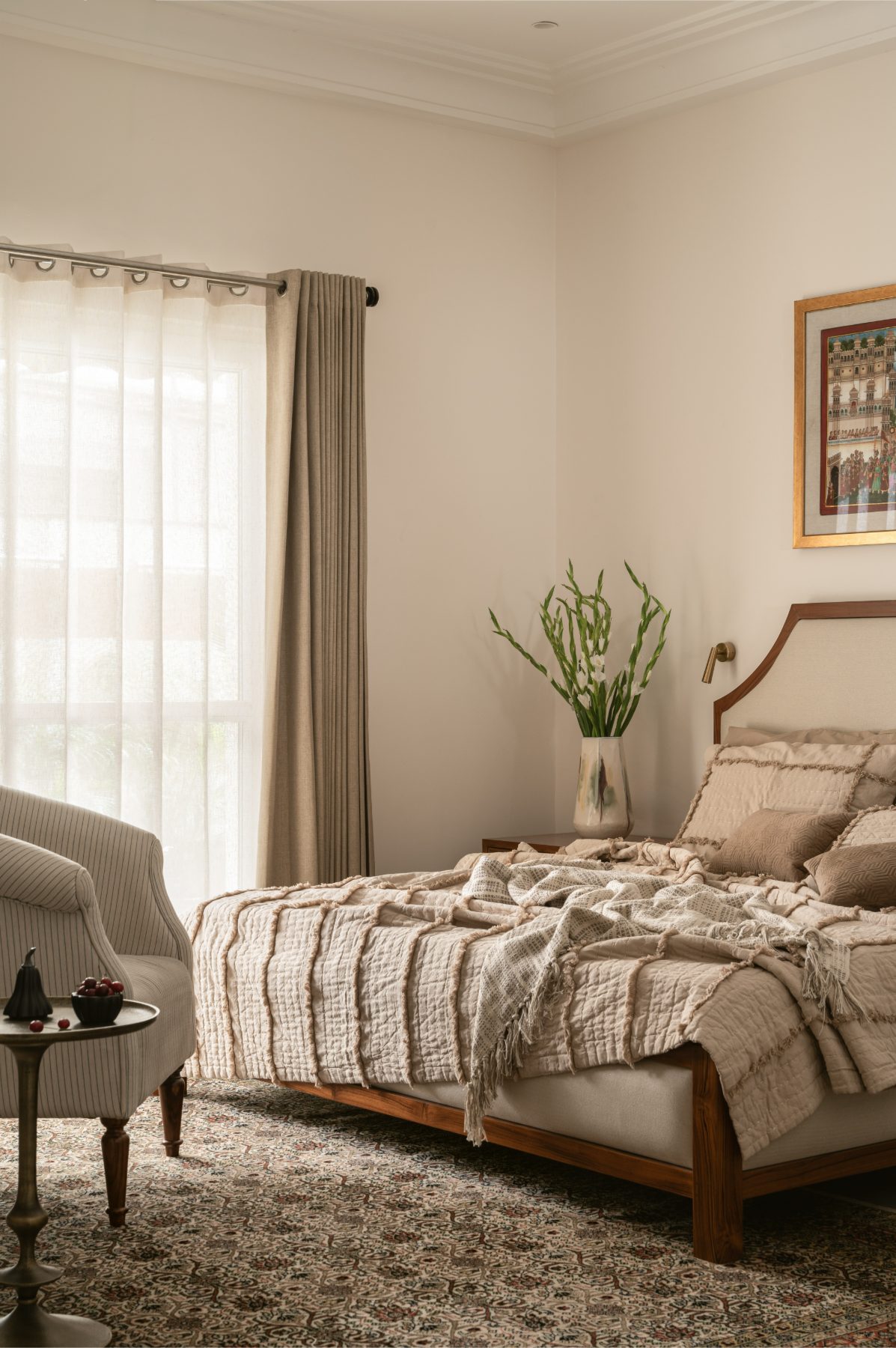 Bedroom with sheer-draped window and morning light
