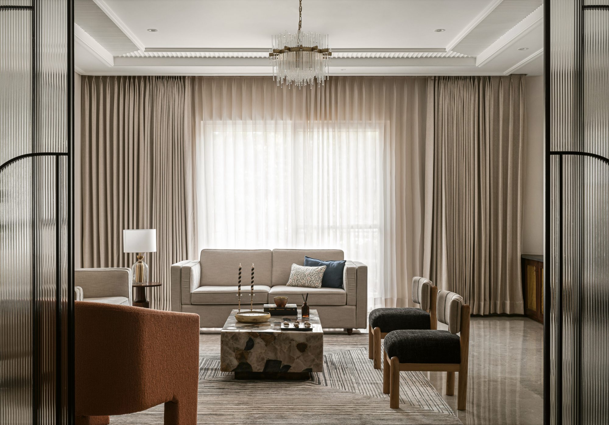 Formal living room with chandelier, classical cornice and layered art