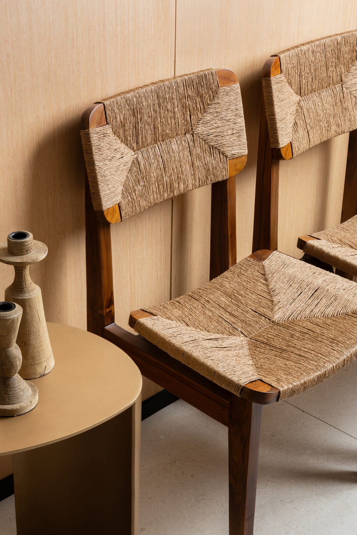 Detail of handwoven cane chairs and ceramic objects