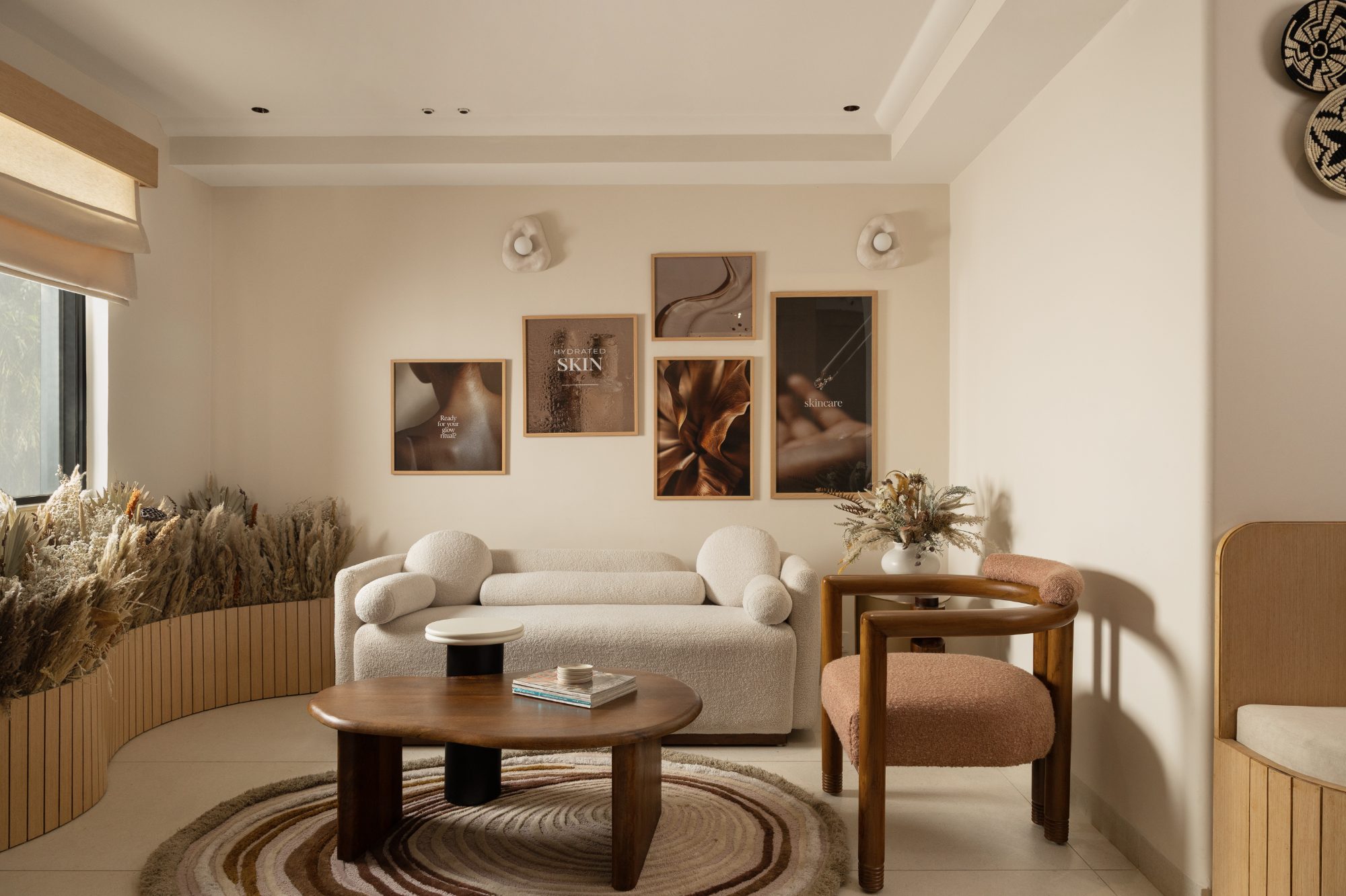Treatment lounge with bouclé seating and an art grid