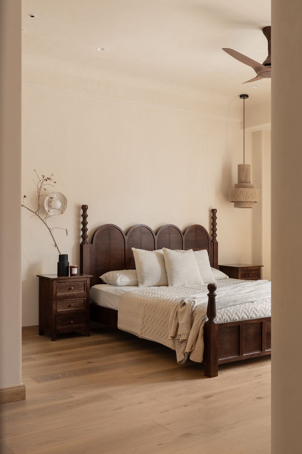 Principal bedroom with a carved dark-wood four-poster bed
