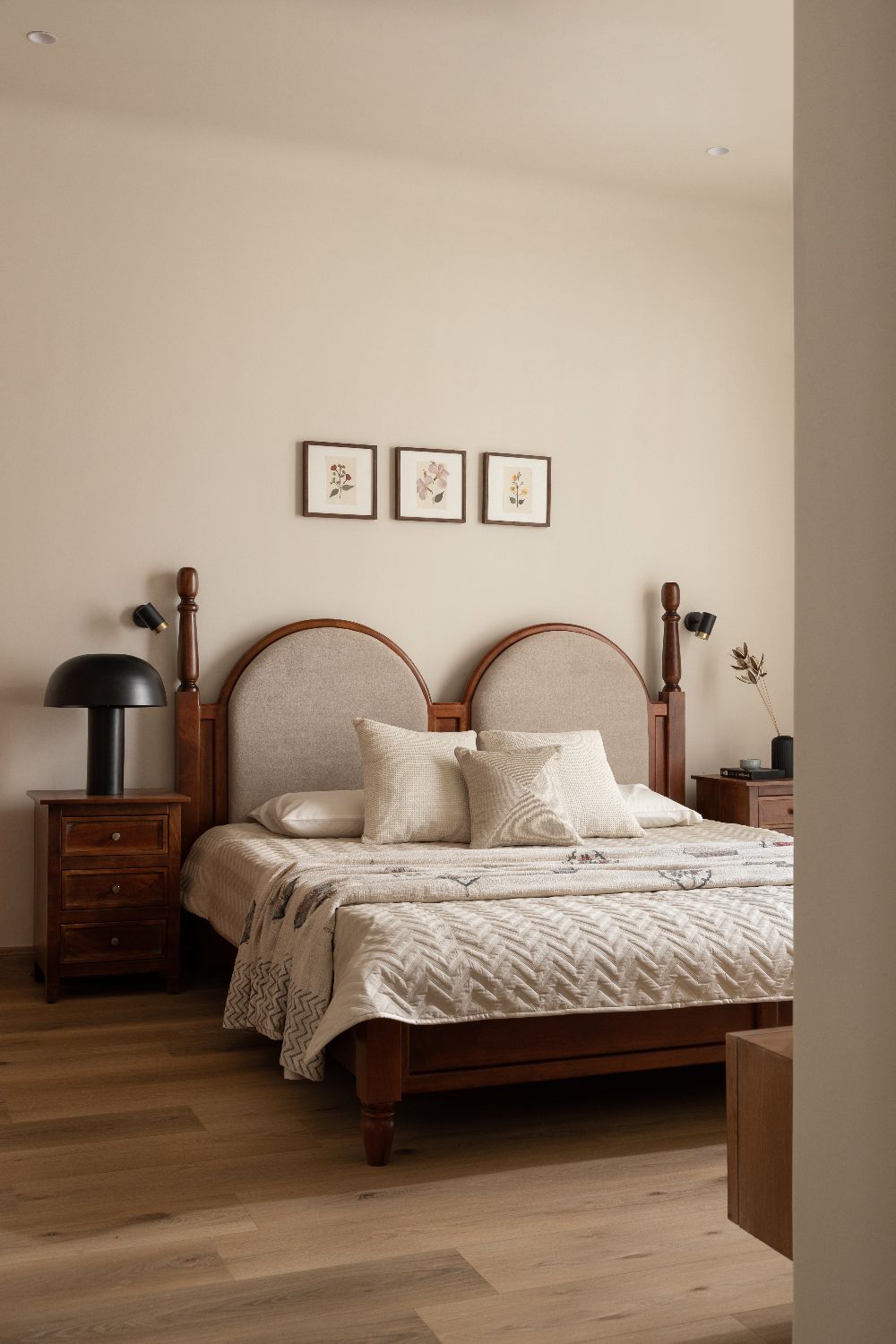 Second bedroom with an arched upholstered headboard