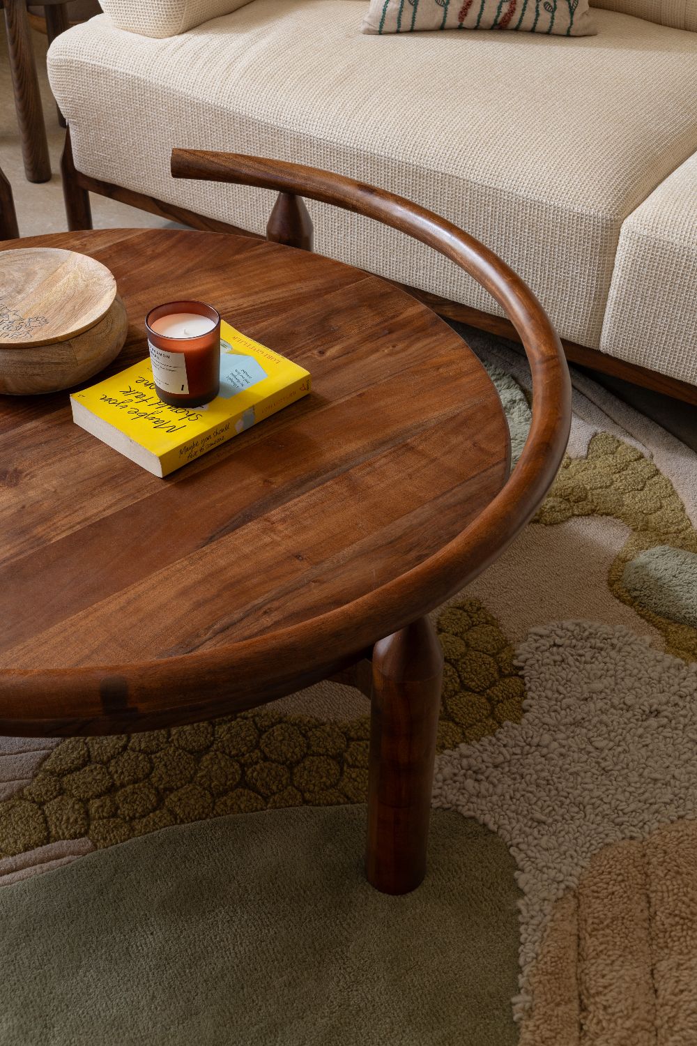 Sculptural curved timber side table