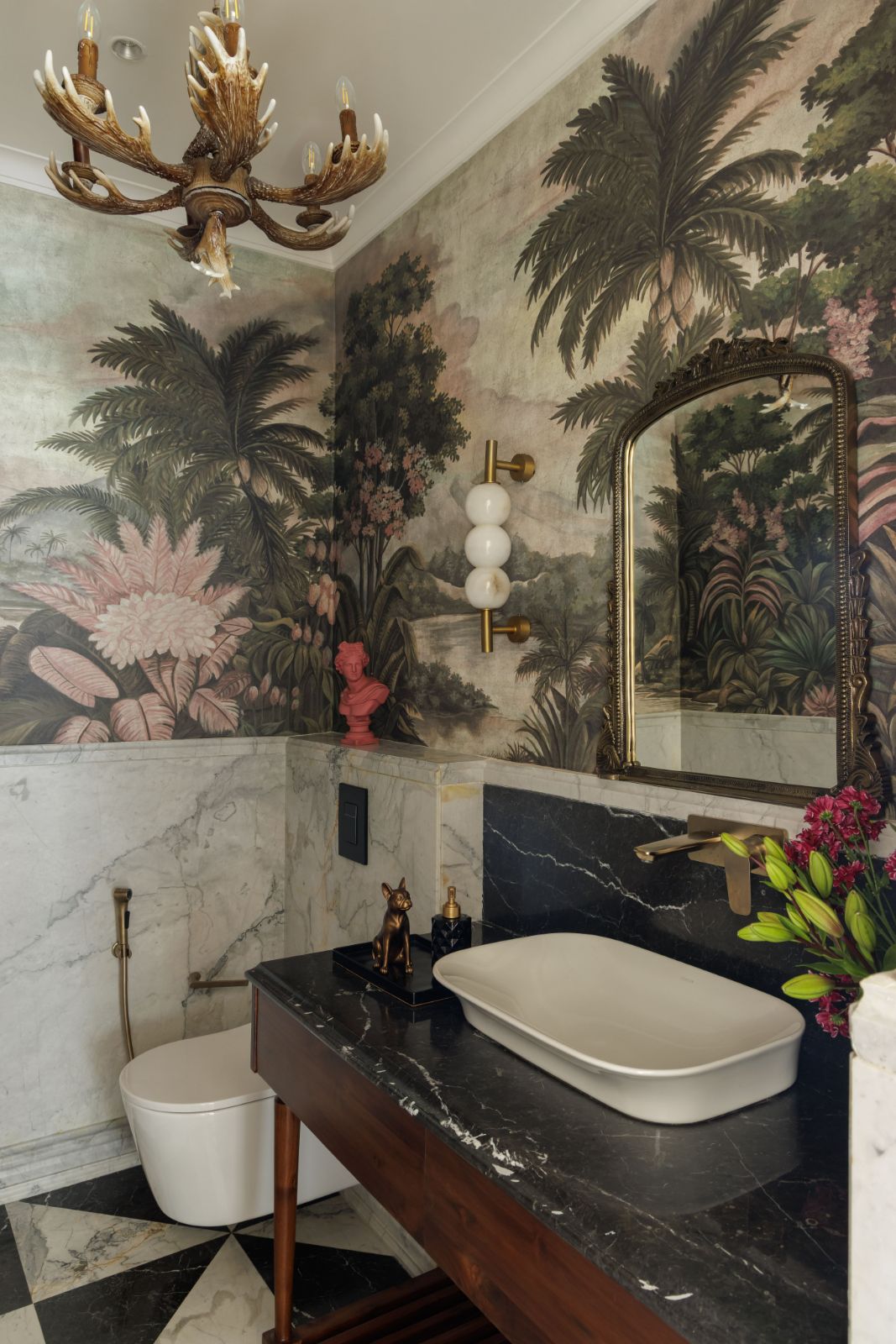Powder room with tropical mural, antler chandelier and checkerboard marble floor