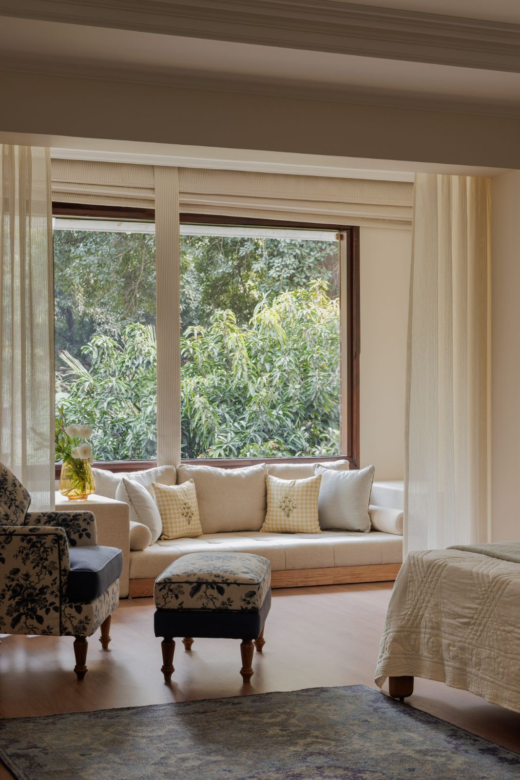 Bedroom window seat framing a garden view
